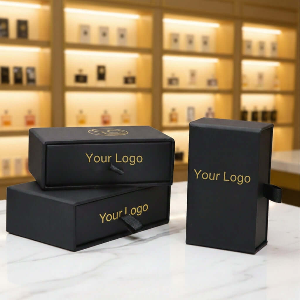 Perfume Oil Bottle with Box showcased in elegant black packaging with gold logo accents, ideal for luxury gifting.