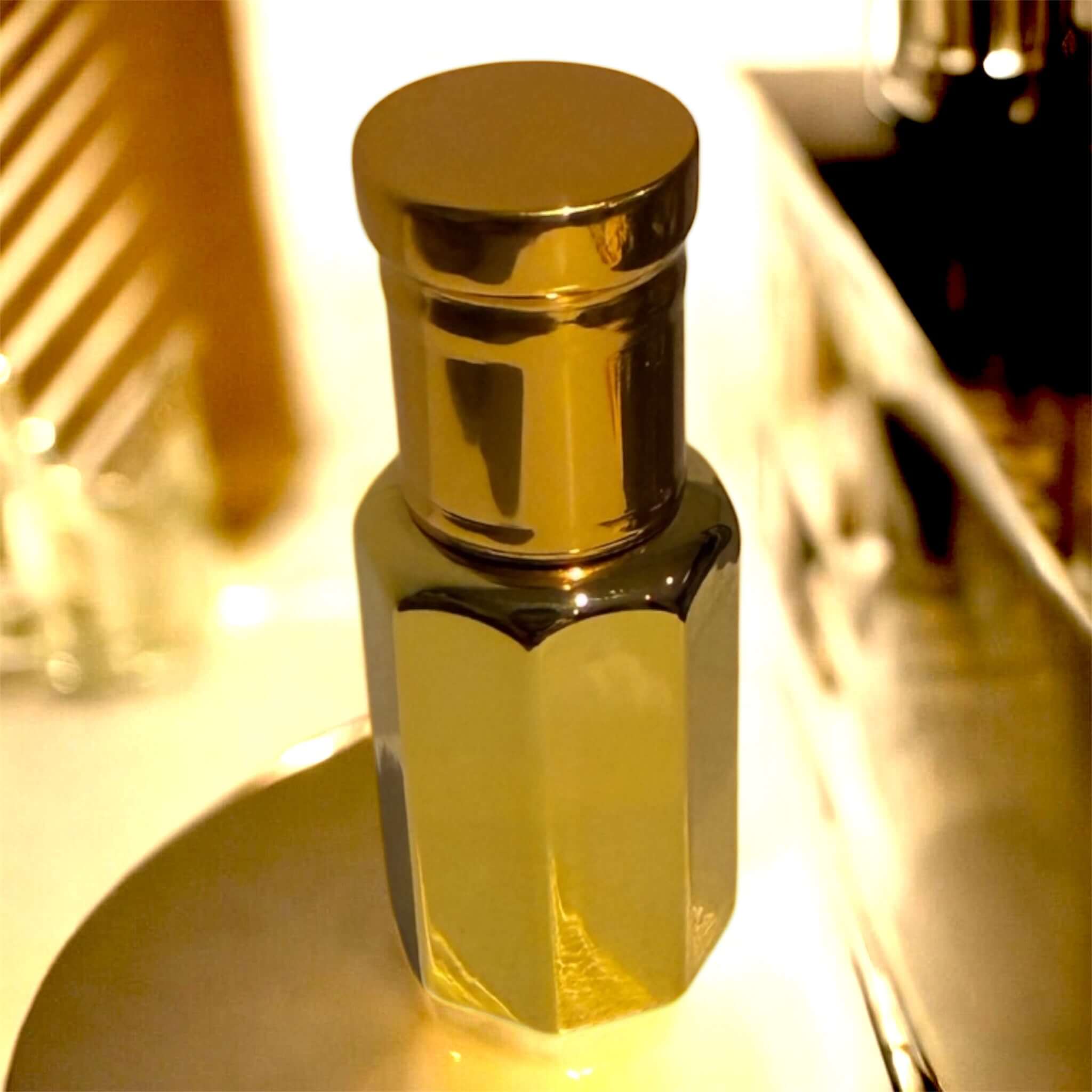 UV Coated Golden Attar Bottles on gold background